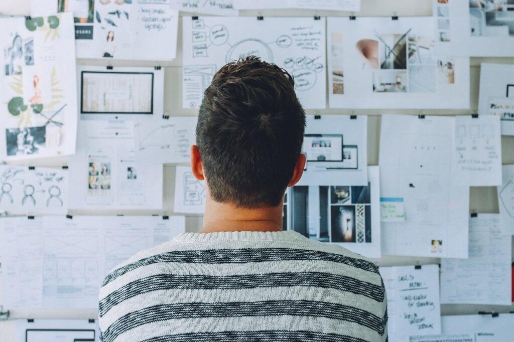 A person looking at various notes.