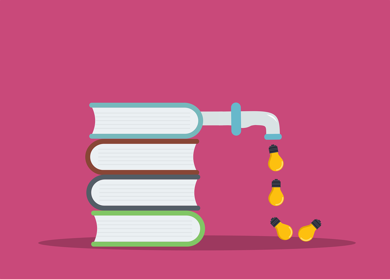 a stack of books with light bulbs